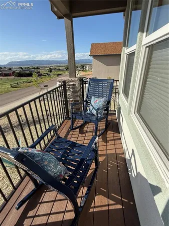 a view of balcony with wooden floor