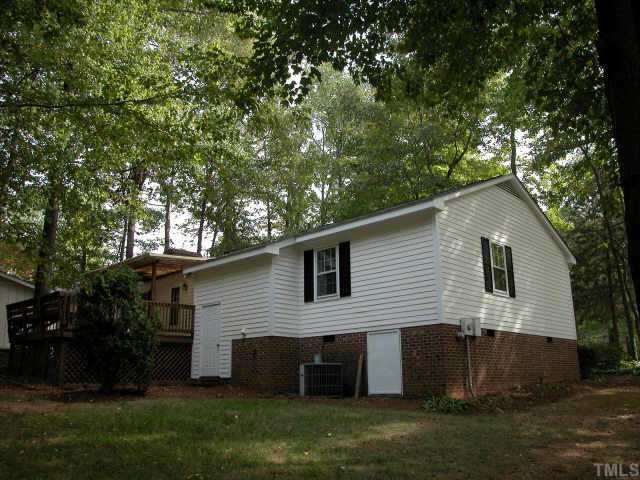 7201 Stuart Drive Raleigh, NC 27615 - Photo 3 of 9 a front view of house with a garden