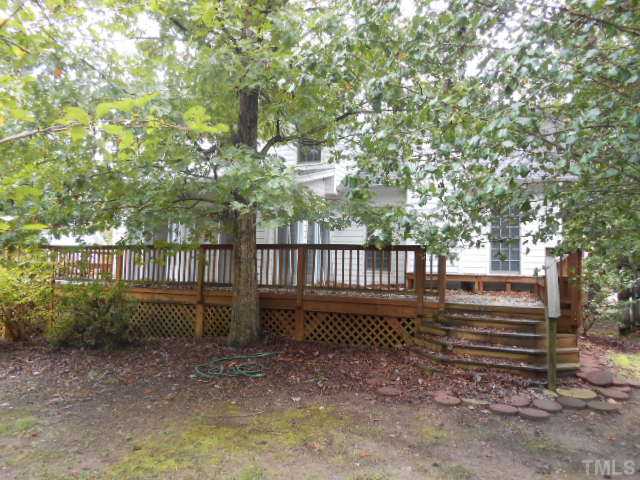 2409 Finley Ridge Lane Raleigh, NC 27615 - Photo 2 of 8 a view of a yard in front of a house