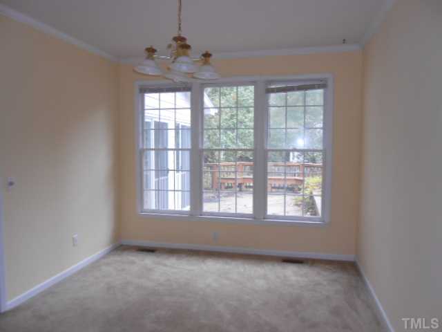 2409 Finley Ridge Lane Raleigh, NC 27615 - Photo 4 of 8 an empty room with a window