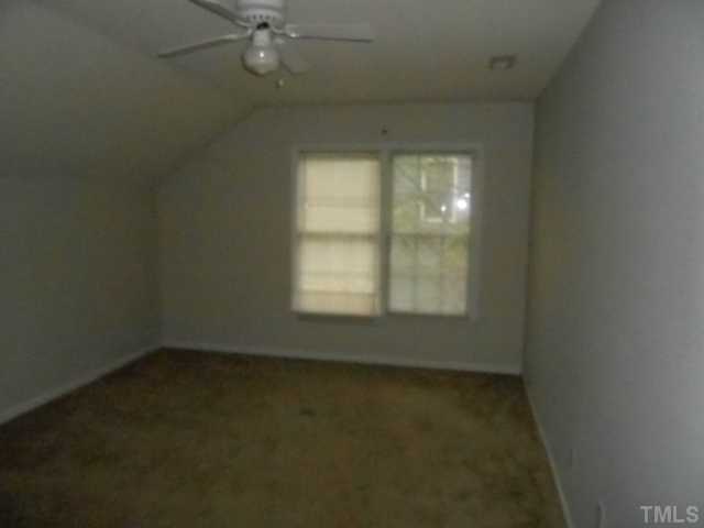 2409 Finley Ridge Lane Raleigh, NC 27615 - Photo 6 of 8 an empty room with a window
