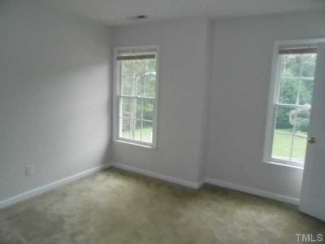 2409 Finley Ridge Lane Raleigh, NC 27615 - Photo 8 of 8 an empty room with a window