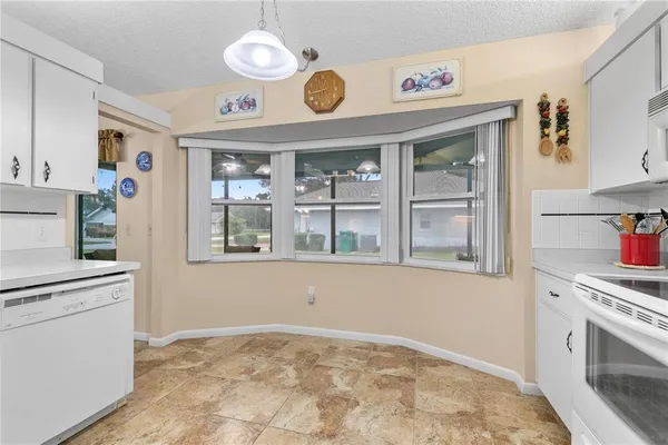 a view of a kitchen with an oven and cabinets