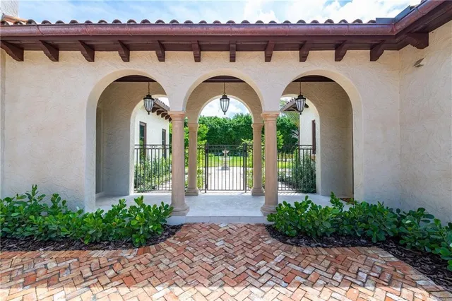 a large kitchen with stainless steel appliances granite countertop a stove and a refrigerator