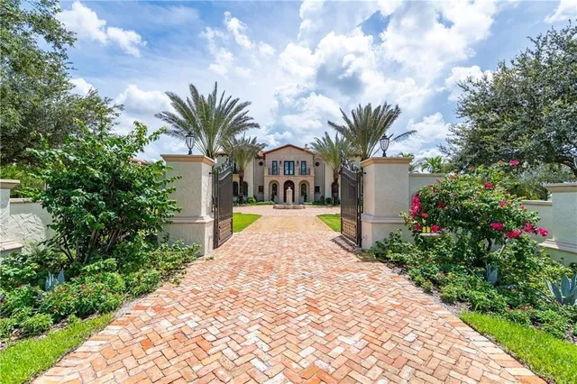 a front view of multi story residential apartment building with yard