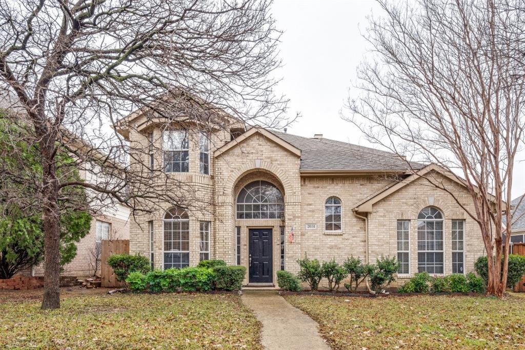 2031 Knights Court Allen, TX 75013 - Photo 1 of 12 a front view of a house with garden