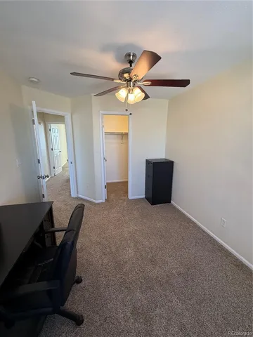 a workspace with furniture and wooden floor
