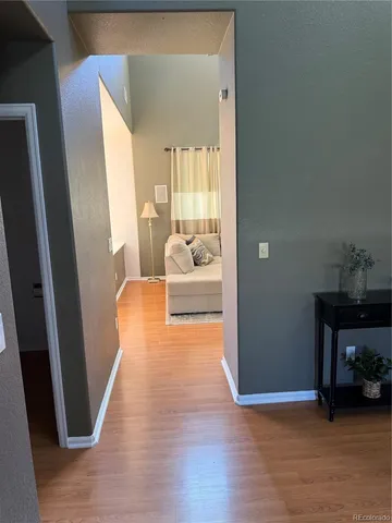 a view of a livingroom with furniture and wooden floor