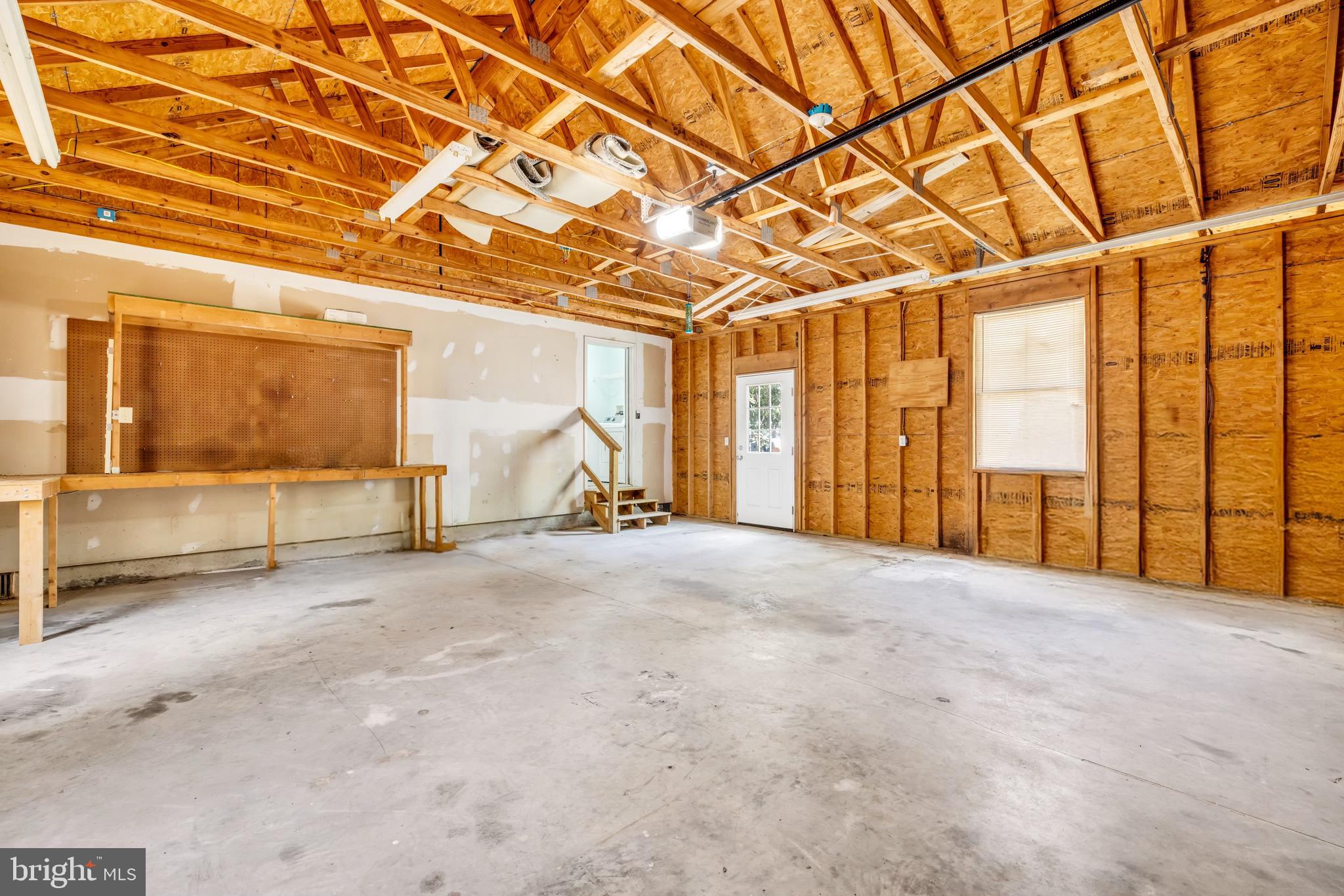 7392 Todds Wharf Road Preston, MD 21655 - Photo 40 of 63 Garage from overhead doorway to kitchen entrance