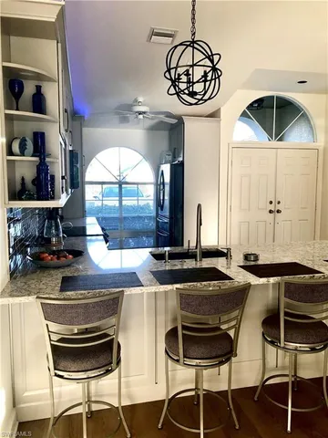 a kitchen with a table and chairs in it