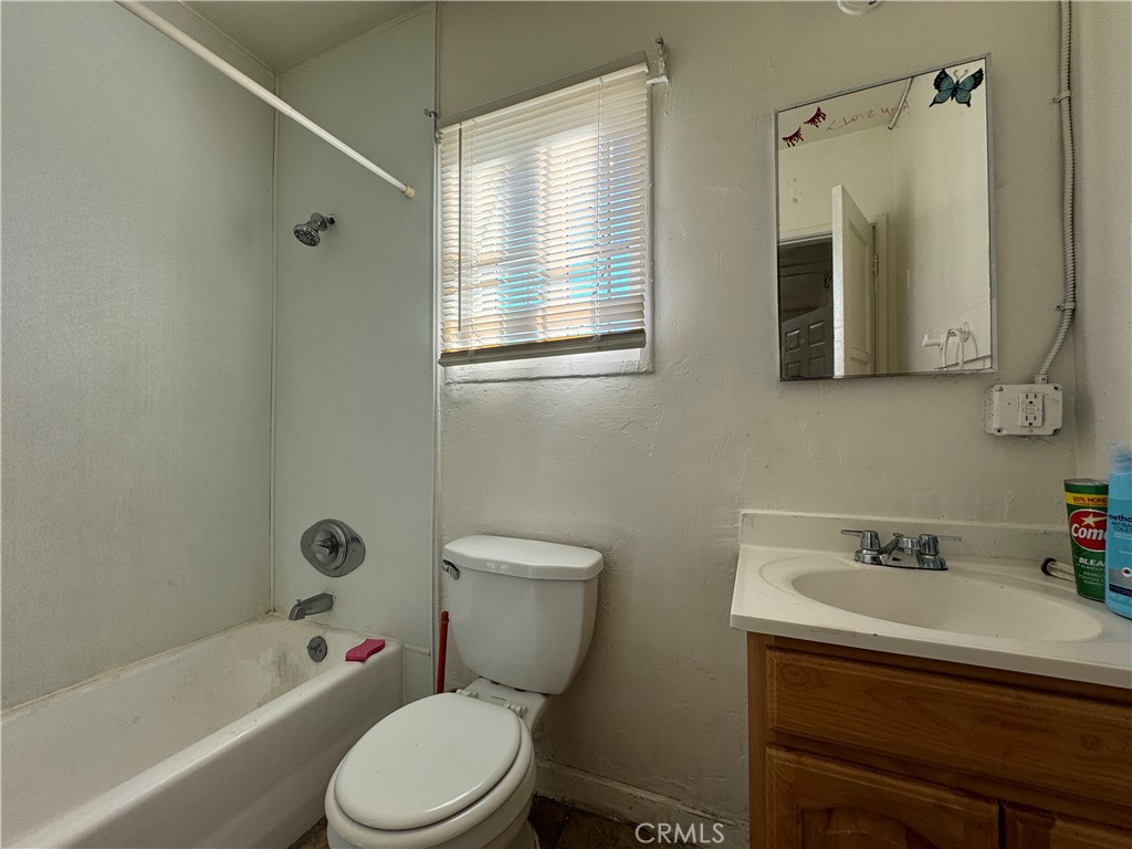 12616 Lambert Road, Unit 5 Whittier, CA 90602 - Photo 3 of 5 a bathroom with a sink a toilet and shower