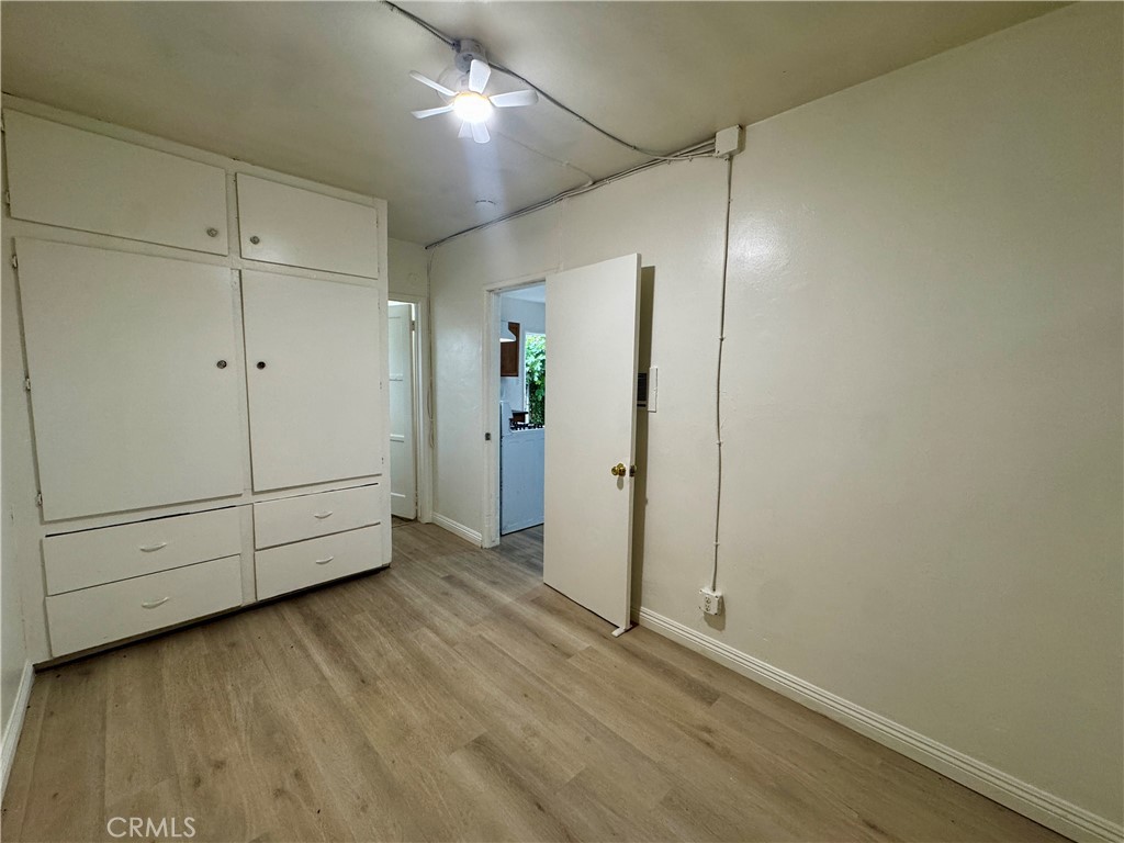 12616 Lambert Road, Unit 5 Whittier, CA 90602 - Photo 4 of 10 an empty room with wooden floor