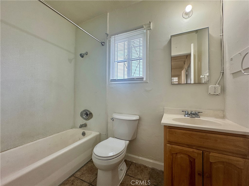 12616 Lambert Road, Unit 5 Whittier, CA 90602 - Photo 5 of 10 a bathroom with a sink toilet and shower