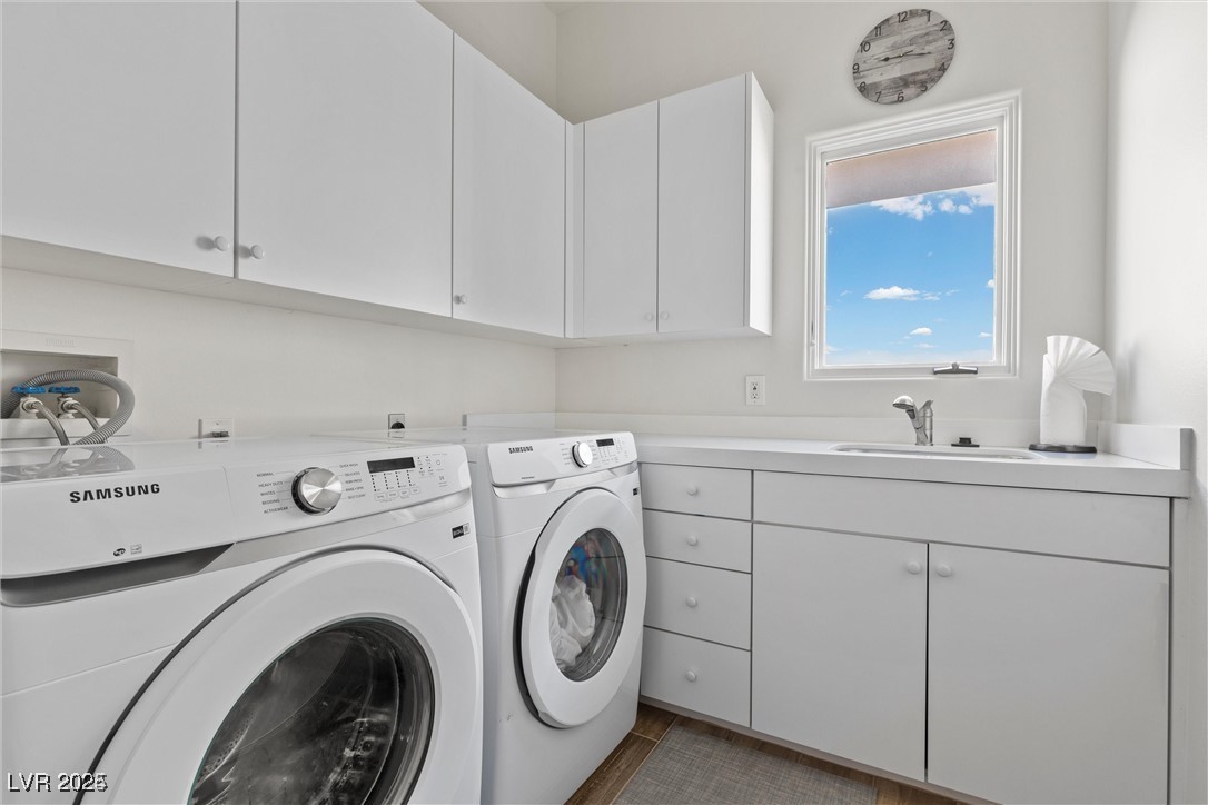3 Rue Allard Way Henderson, NV 89011 - Photo 30 of 49 Laundry room with cabinet space, a sink, and washing machine and clothes dryer