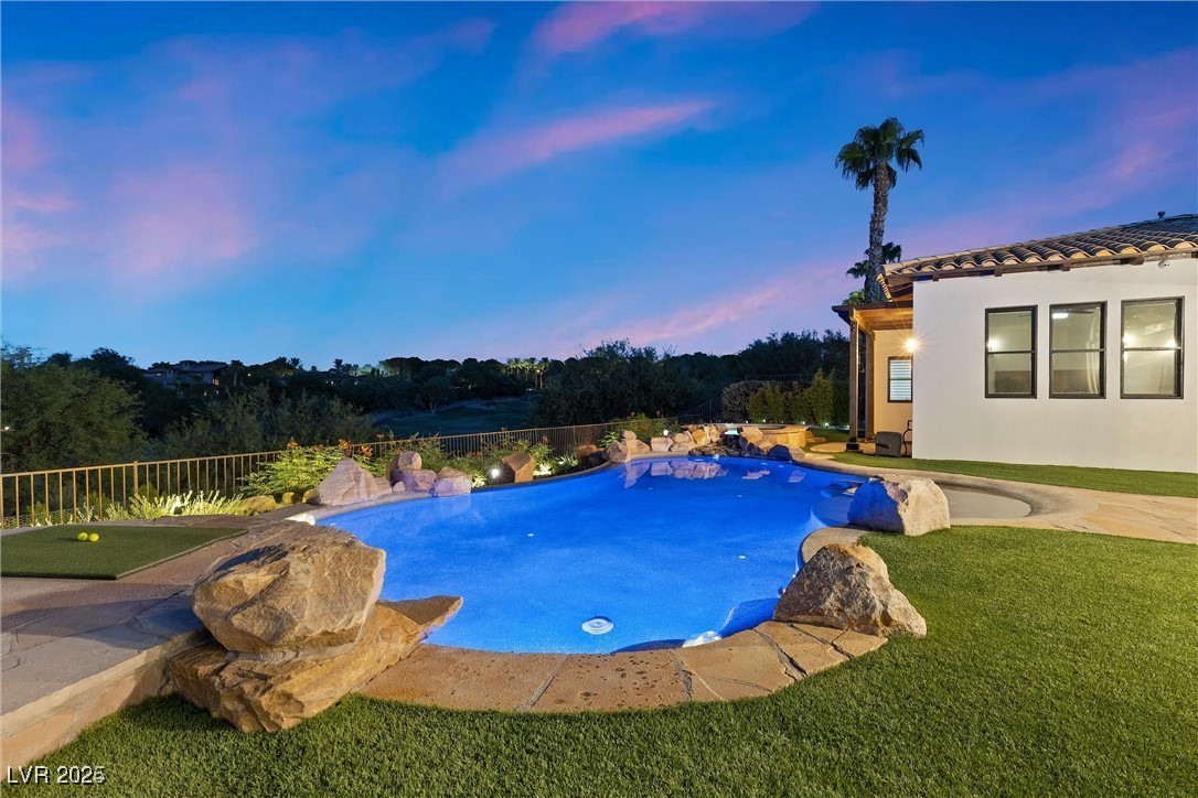 3 Rue Allard Way Henderson, NV 89011 - Photo 34 of 49 View of swimming pool with a fenced in pool, a yard, and fence