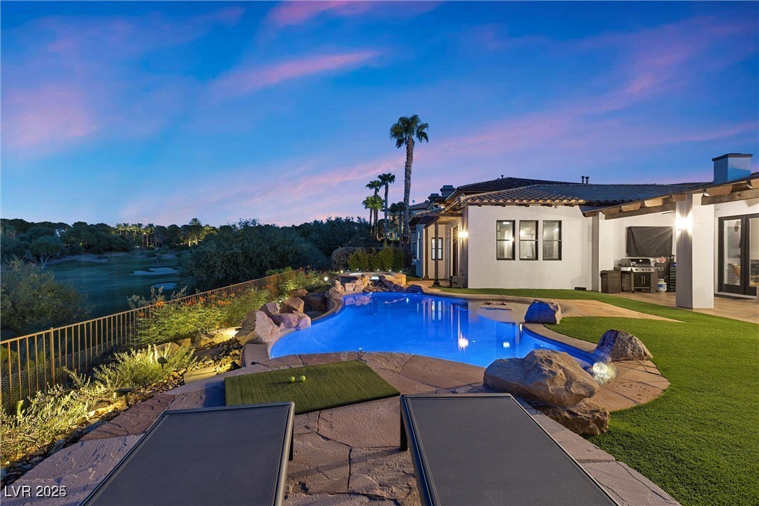 3 Rue Allard Way Henderson, NV 89011 - Photo 36 of 49 Pool at dusk featuring fence private yard, a patio, a fenced in pool, and a yard