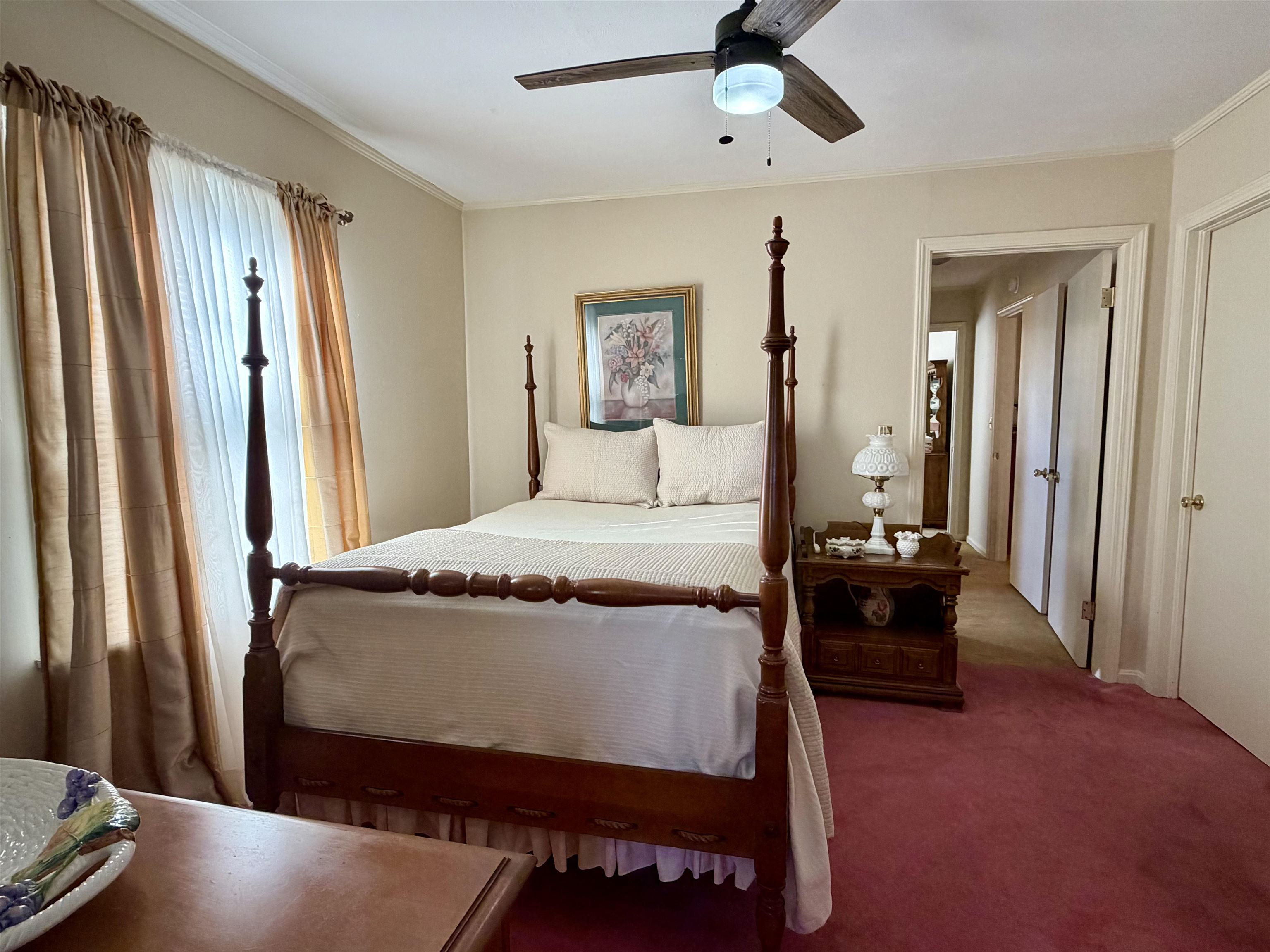 192 New Bethel Road Selmer, TN 38375 - Photo 15 of 27 Bedroom with carpet flooring, ceiling fan, and crown molding