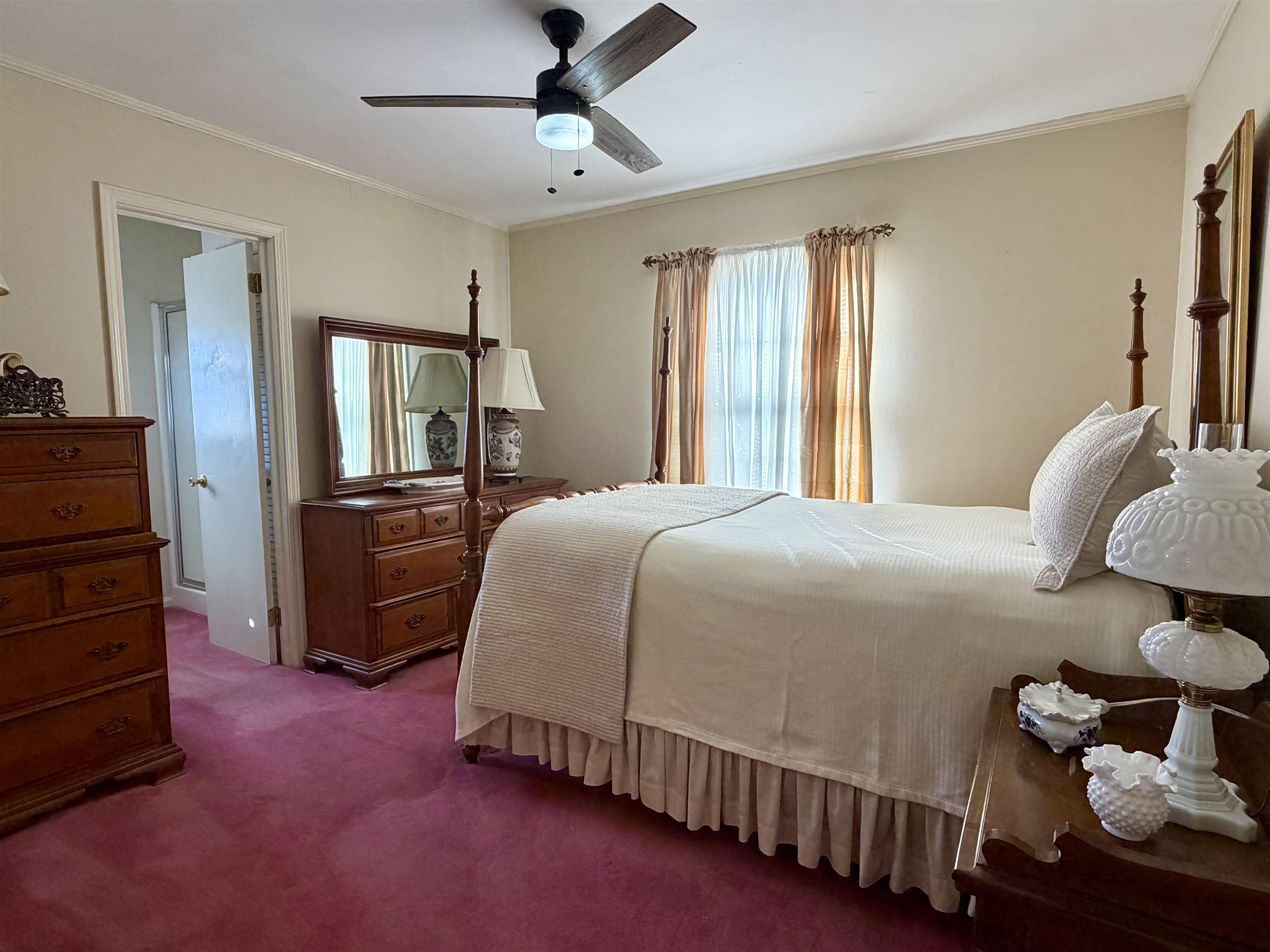 192 New Bethel Road Selmer, TN 38375 - Photo 16 of 27 Carpeted bedroom featuring a ceiling fan and crown molding