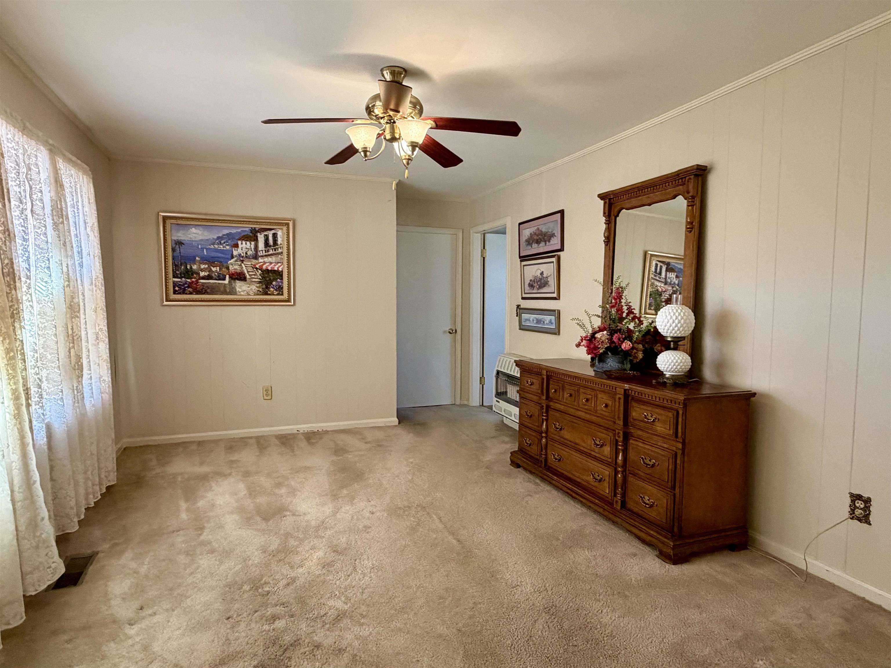 192 New Bethel Road Selmer, TN 38375 - Photo 23 of 27 Bedroom featuring a ceiling fan and light colored carpet