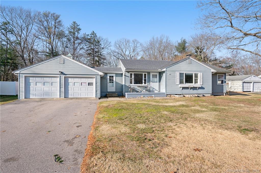 a front view of a house with a yard