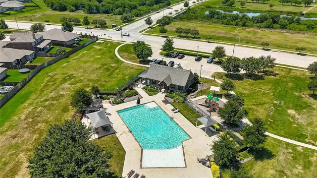 an aerial view of a house with a lake view