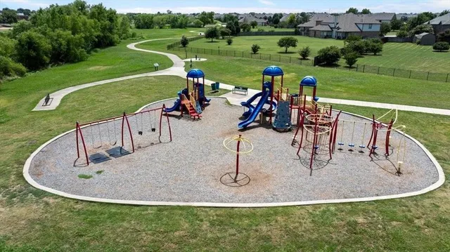 a view of a swimming pool and a yard