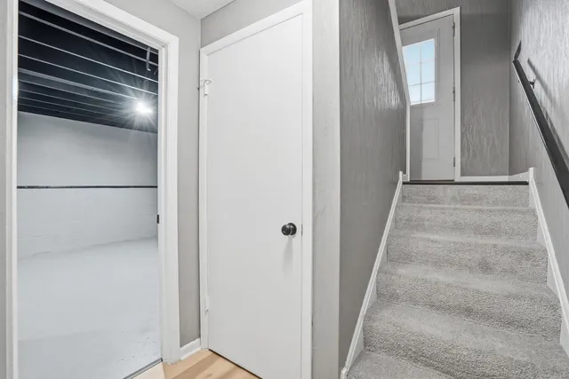 a view of staircase with wooden floor