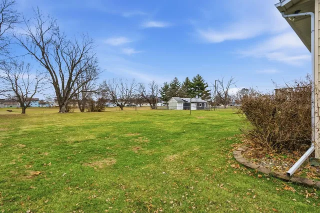 a backyard of apartments with large trees
