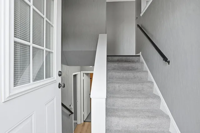a view of entryway with furniture and window