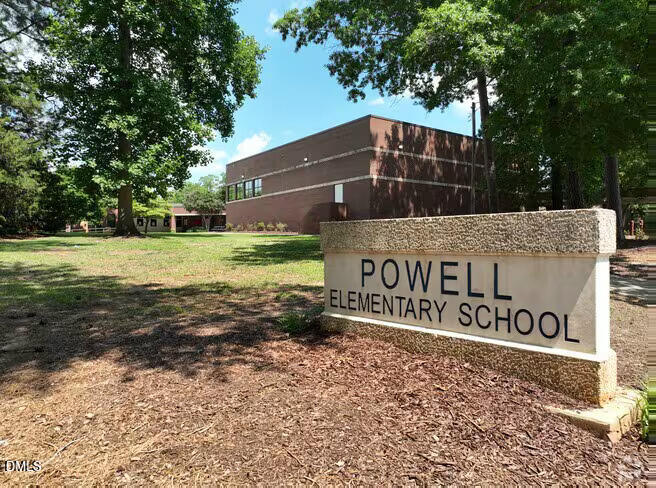 217 Heck Street Raleigh, NC 27601 - Photo 22 of 22 a sign of golf club on a wall