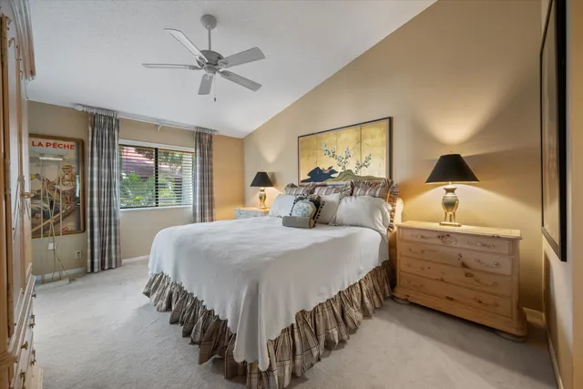 a bedroom with a bed and a mirror