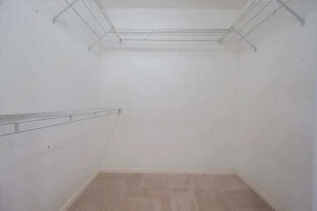 a bedroom with a bed and a cabinets