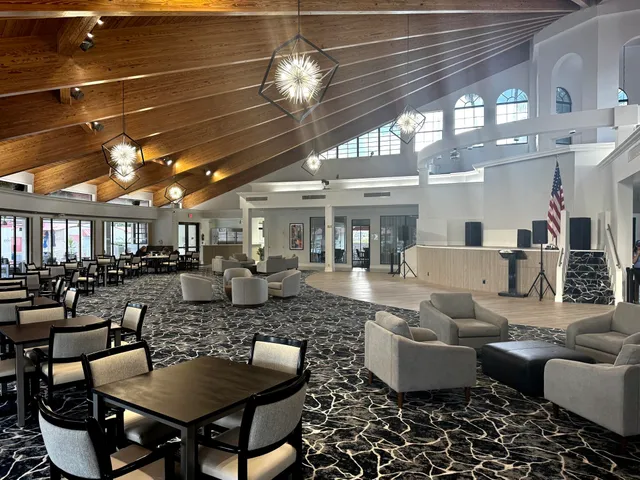 a kitchen with a sink a counter top space stainless steel appliances and a counter top space
