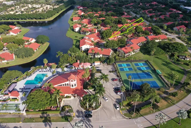 an aerial view of residential house with outdoor space and swimming pool