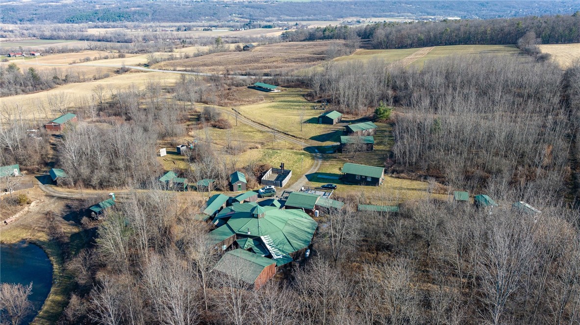 9470 Schmidt Road West Sparta, NY 14437 - Photo 2 of 43 Located on 48+ acres with a stocked pond, bunk hou