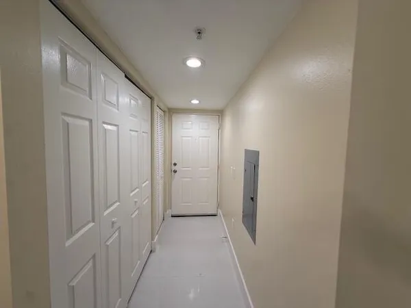 a view of an empty room and window