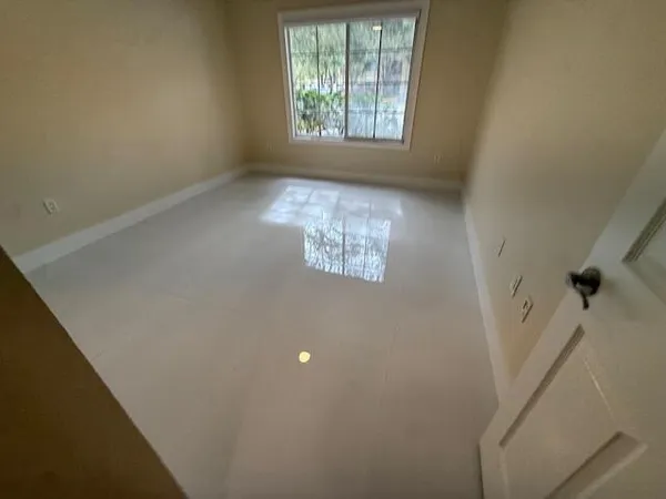 a spacious bathroom with a granite countertop sink a toilet and bathtub