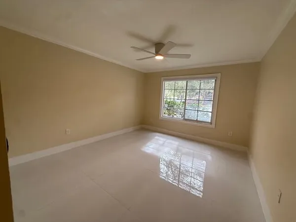 a bathroom with a granite countertop sink mirror vanity and toilet