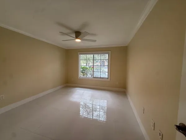 a bathroom with a granite countertop sink toilet mirror and bathtub