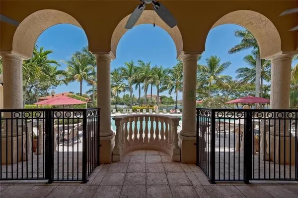 a view of a house with swimming pool and sitting area