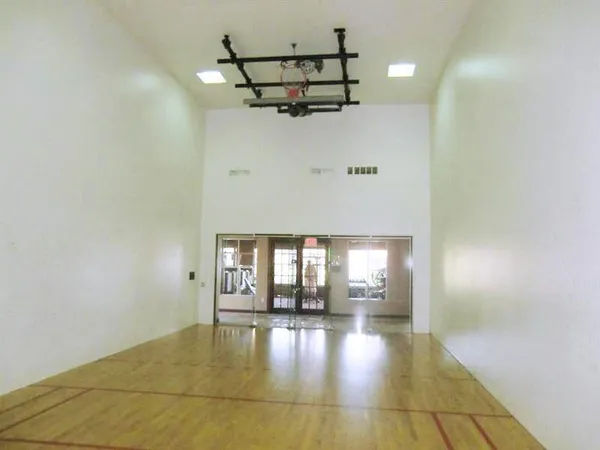 a view of a swimming pool with a table and chairs