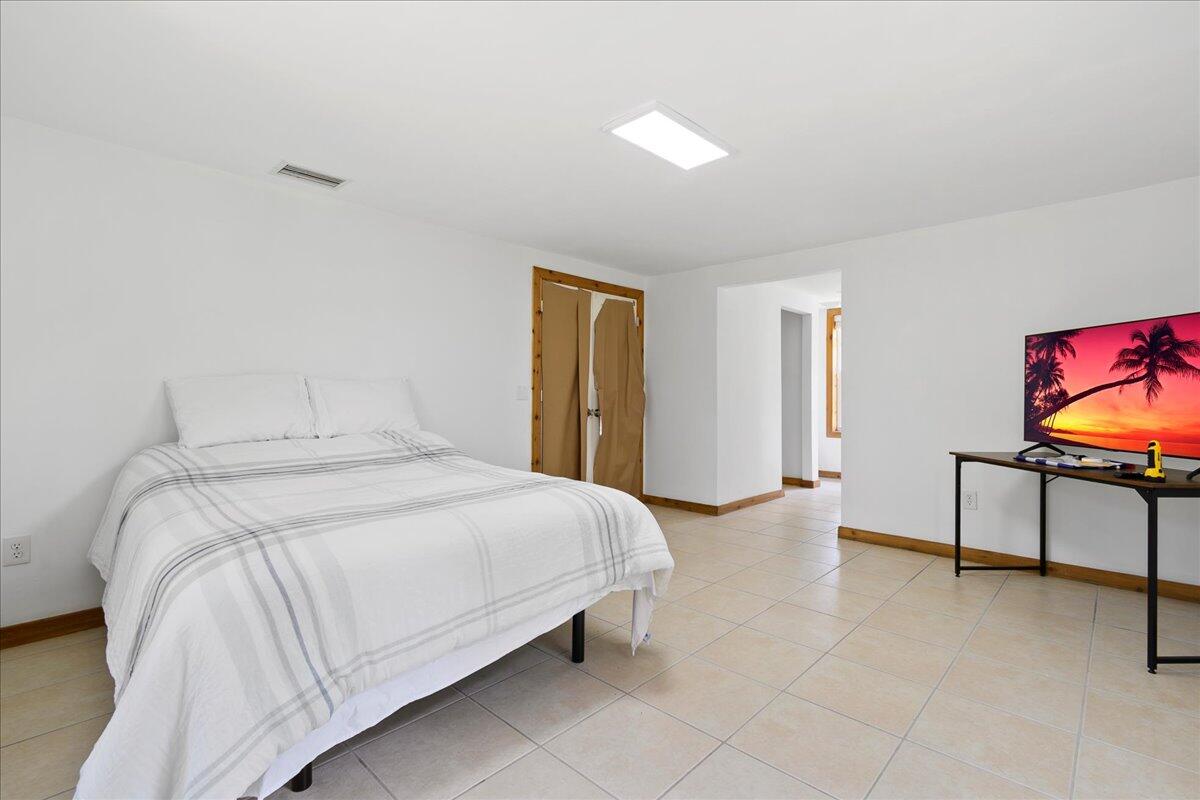 8951 Southwest Fox Brown Road Indiantown, FL 34956 - Photo 18 of 34 Primary Bedroom