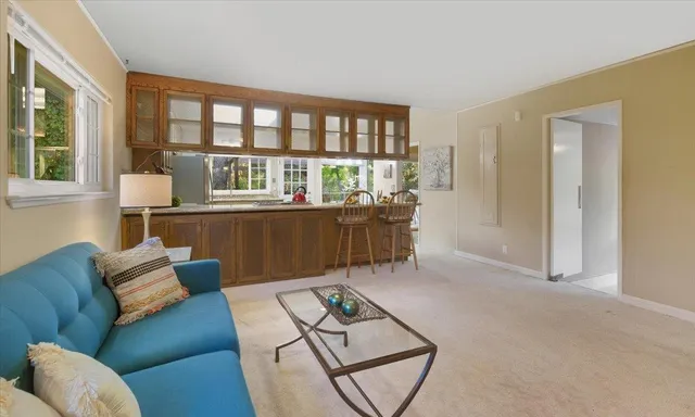 a living room with furniture and a table