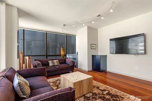a living room with furniture and a flat screen tv