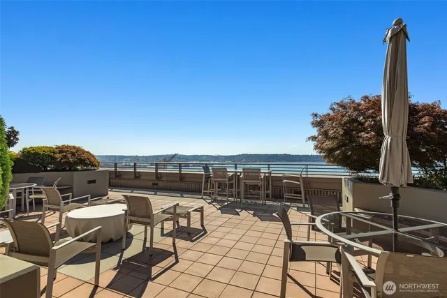 a terrace with a table and chairs