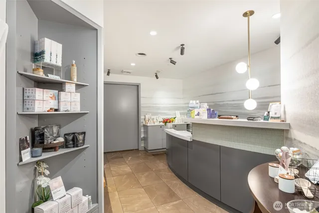 a kitchen with stainless steel appliances granite countertop a sink a refrigerator and a stove