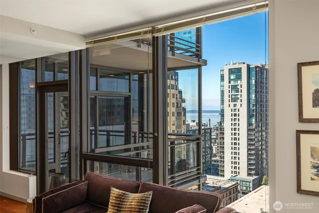 a balcony view with a glass door