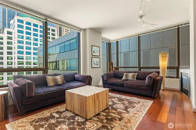 a living room with furniture and a rug