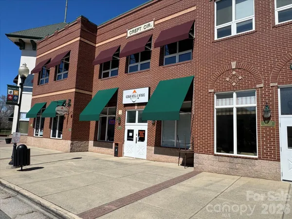 a view of a building with a street