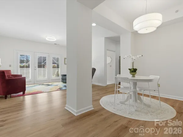 a dining room with table and chairs
